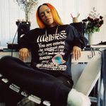 Image of model wearing graphic tshirt