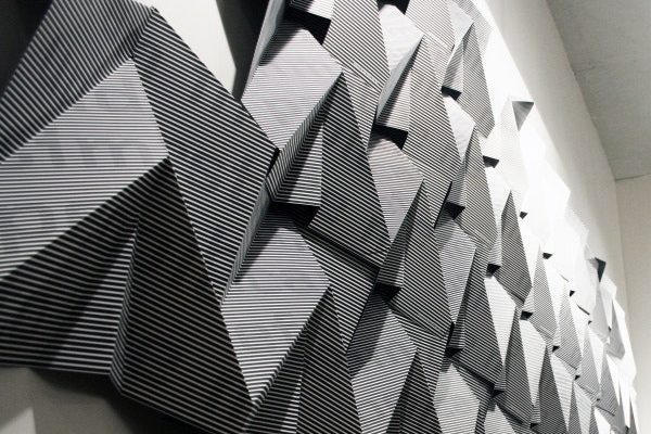 A textured wall-sized artwork hanging at the Walker Art Center