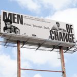 Buildboard with images of historical Black men and the words Men of Change