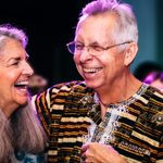 Two adults laughing at a Walker Art Center event