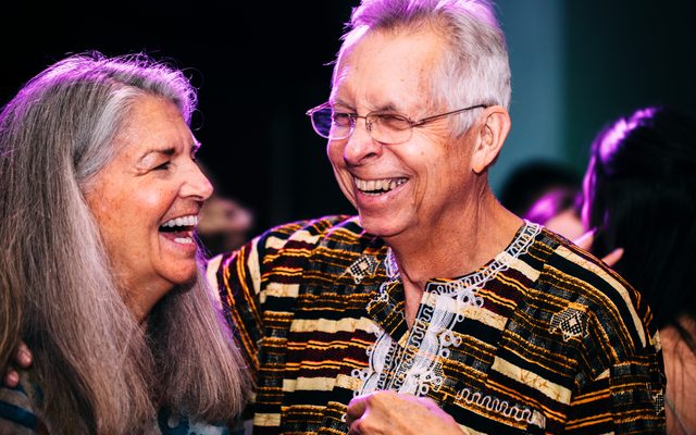 Two adults laughing at a Walker Art Center event