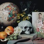 Sill life of skull, oranges, globe, magazine, flowers