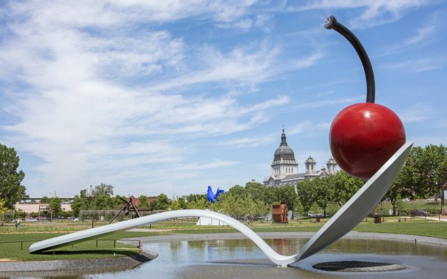 Spoonbridge sculpture in garden, a spoon with a cherry on it